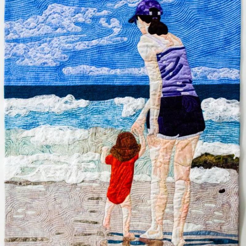 Artwork by Laurie Mutalipassi (a woman and child on the beach)