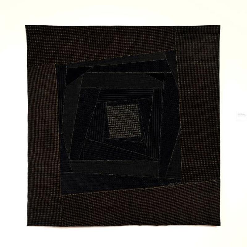 Kyoung Ae Cho - He Was Formal (a quilt in browns and blacks with dot patterns. Concentric rhomboid shapes spiral towards the center)