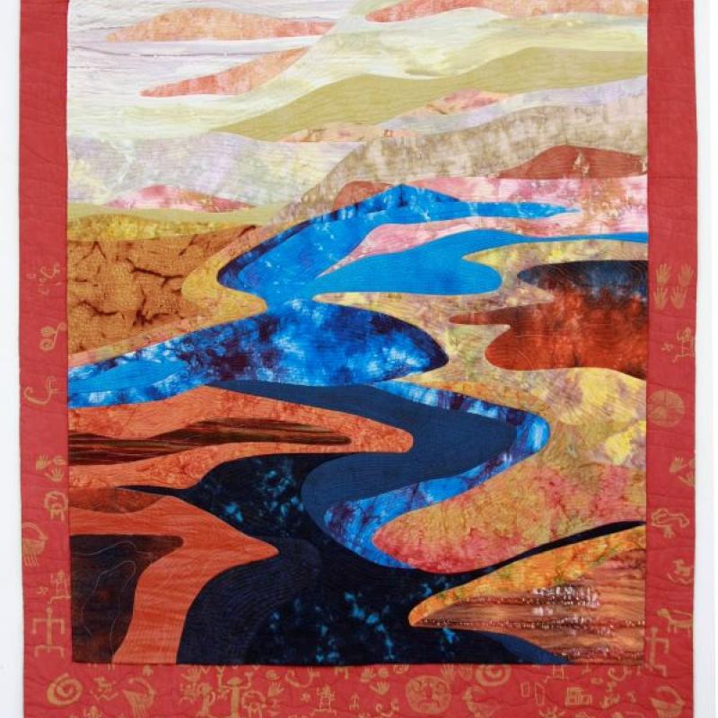 Brenda H. Smith - Glen Canyon 3 (a quilt with large geometric shapes that form a landscape with a river running through it)