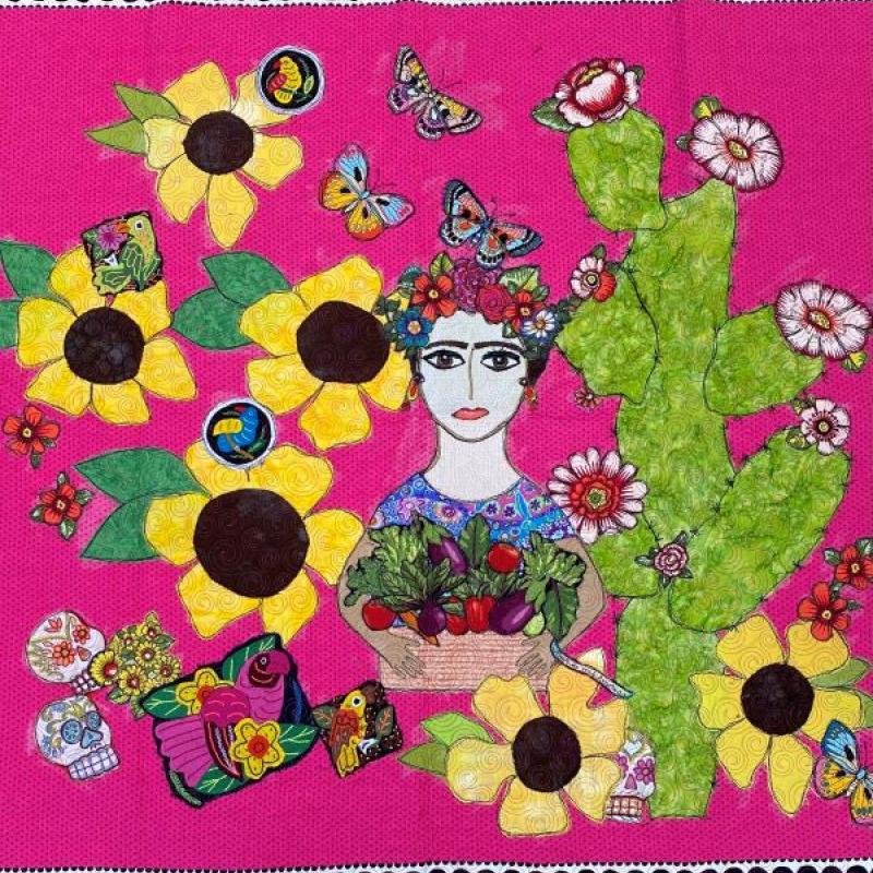 Sandi daRoza - Folklore (Mi Mexico) a woman with a flower crown holds a basket of vegetables. She is surrounded by flowers, butterflies, birds, and sugar skulls on a hot pink background.