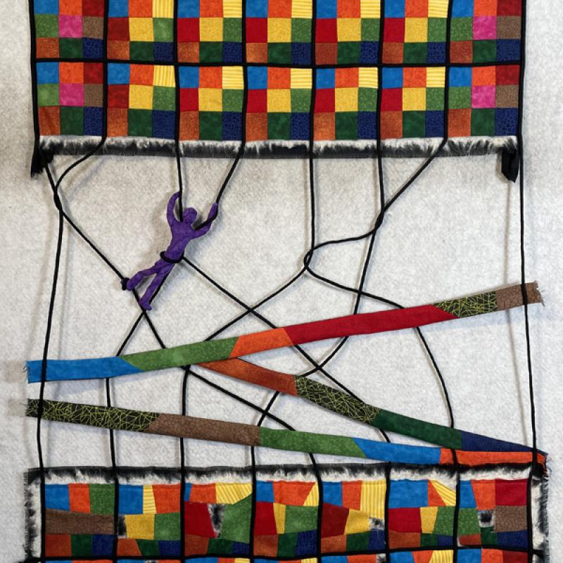 Heather G. Stoltz - Tangled in the Time Between (a figure is tangled in cords between two patchwork segments. The top is an orderly 9-patch, the bottom 9-patch has crooked lines and some frayed holes)